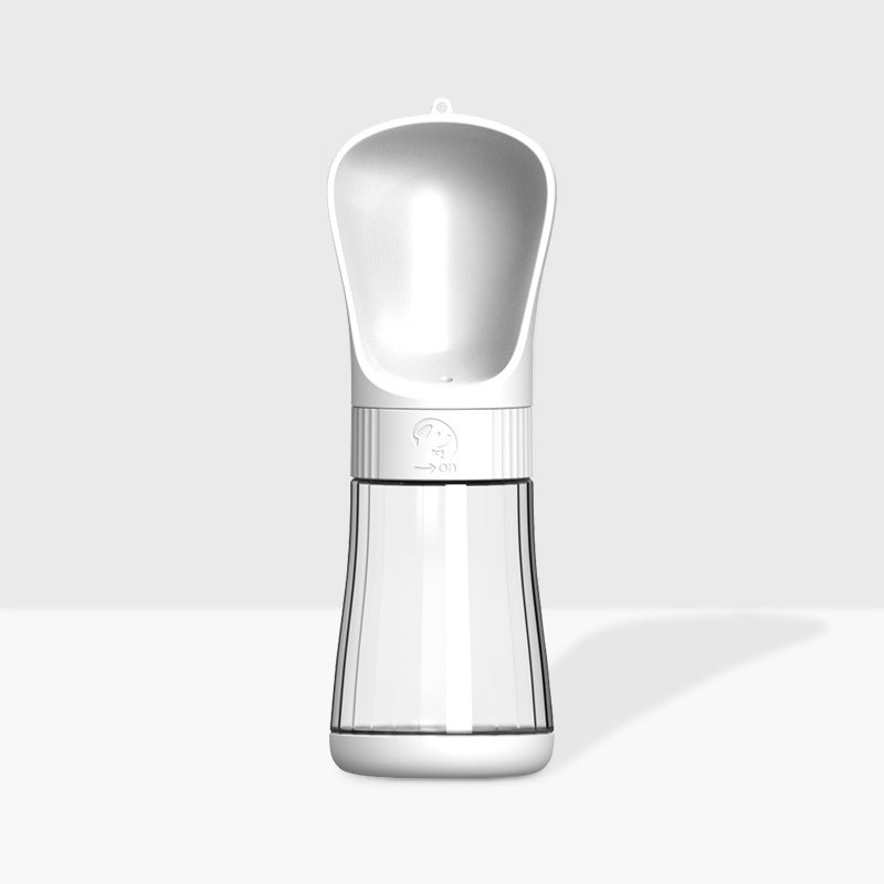 The Dog Travels With A Water Cup To Drink From An Outdoor Water Fountain